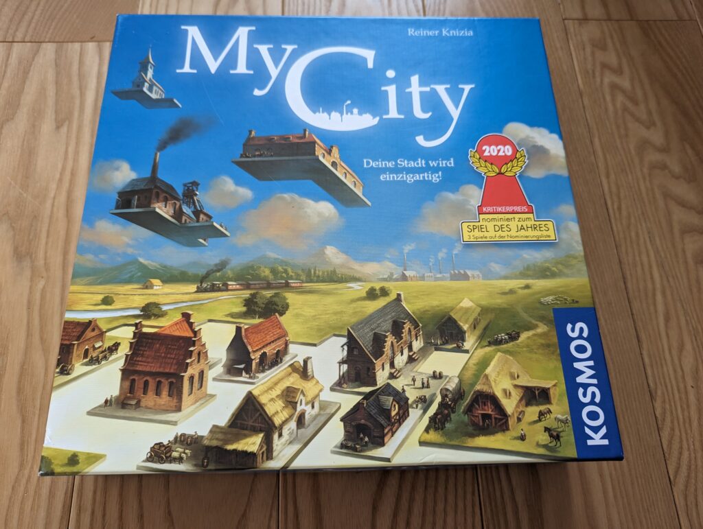 Foto der Spielbox des Brettspiels My City, nominiert zum Spiel des Jahres 2020, Autor Reiner Knizia, KOSMOS Verlag
